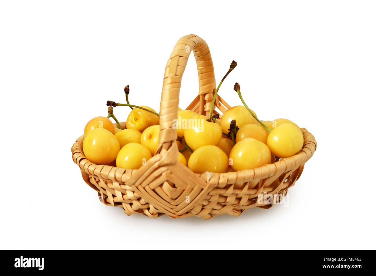 Basket of sweet cherries isolated on white background Stock Photo