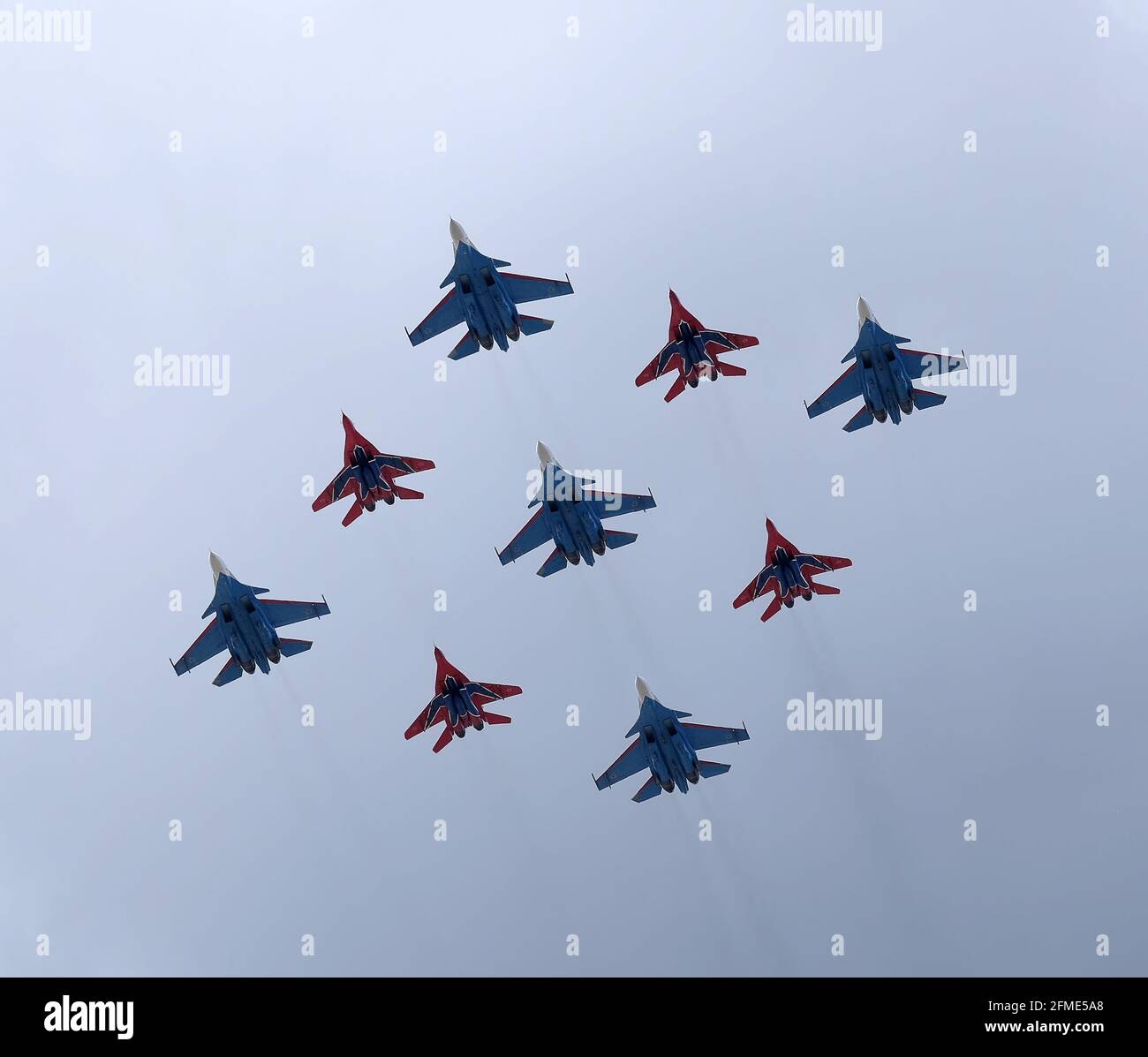 MOSCOW, RUSSIA - MAY 7, 2021: Airplanes of aerobatic groups Russian Knights and Swifts on MIG-29 and SU-27 fighters flights  on parade rehearsal Stock Photo