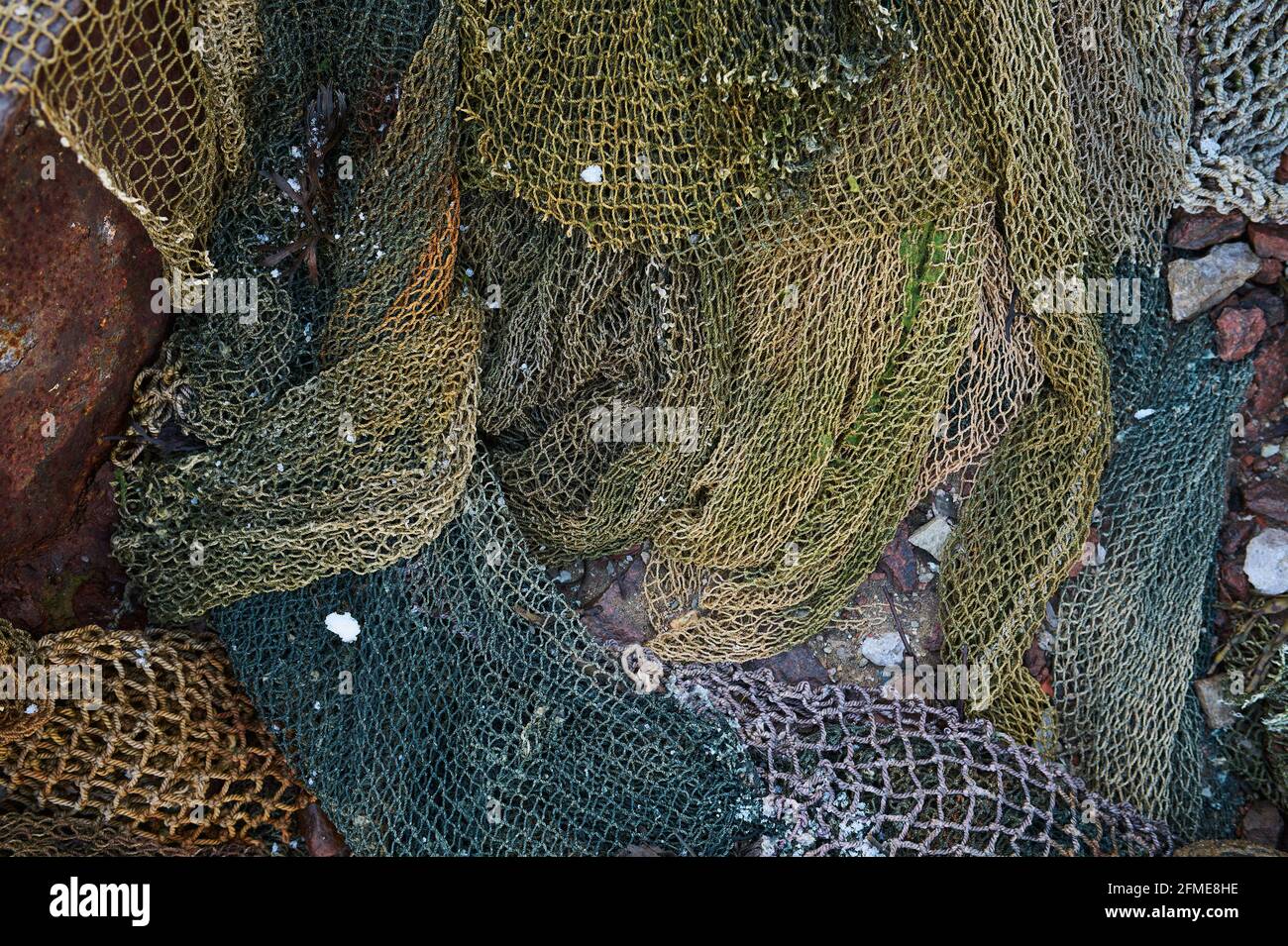 A fishing net is a net used for fishing. Nets are devices made from