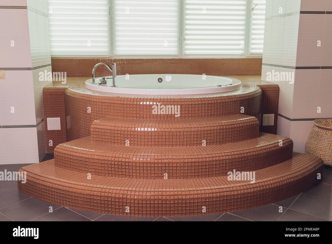 jacuzzi bath tub on marble floor with water Stock Photo Alamy