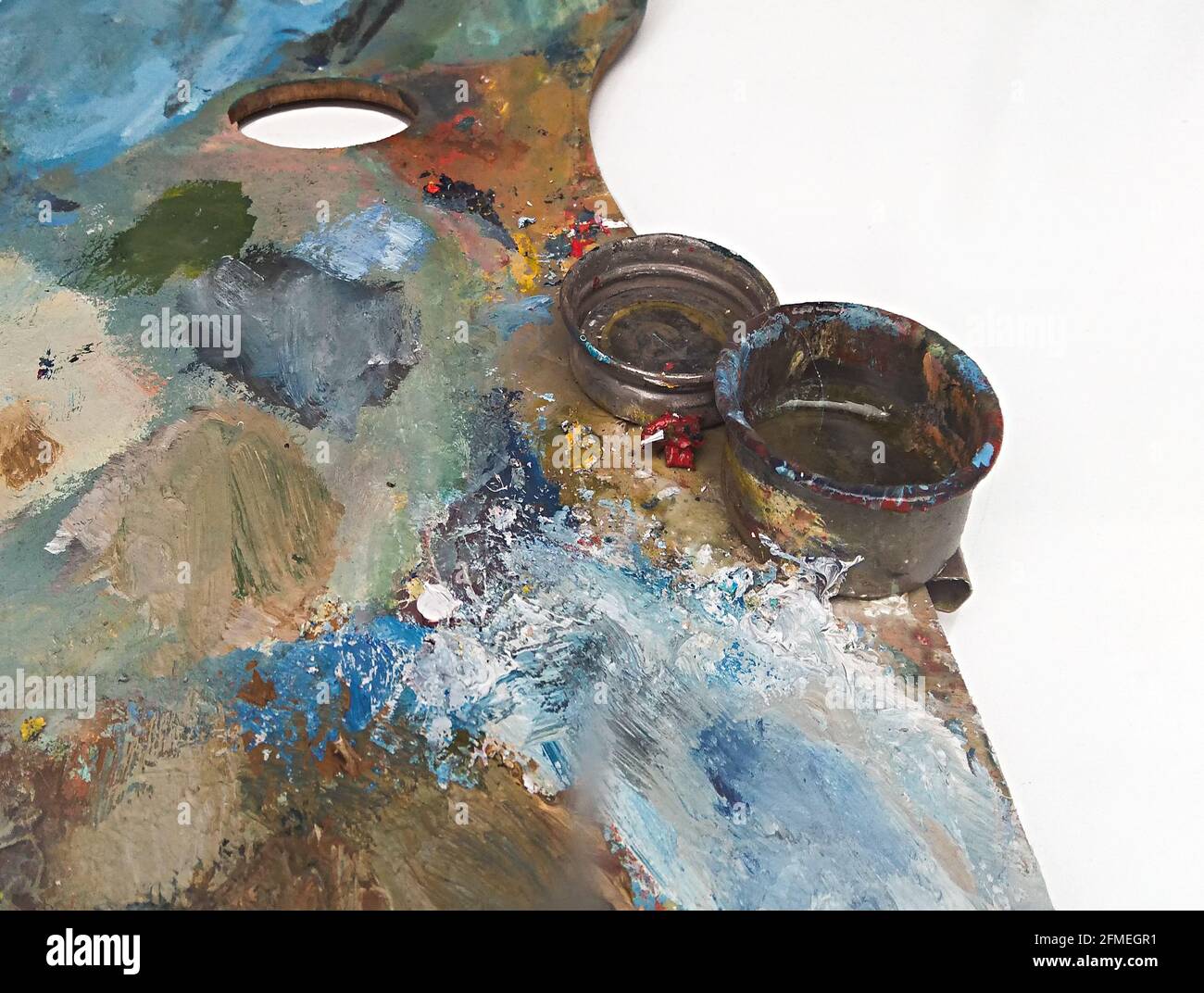 Used Artist paint palette of colorful oil paints on a wooden background for  drawing and painting Stock Photo - Alamy