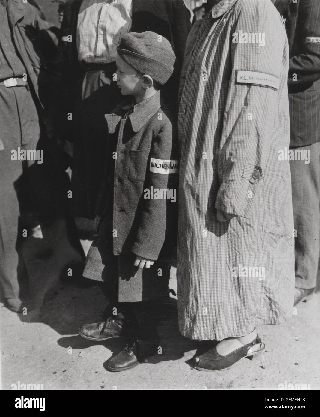 World War Two II The Holocausts 7 year old survivor of the Buchenwald concentration camp complex waiting to be processed after liberation of the camp Stock Photo