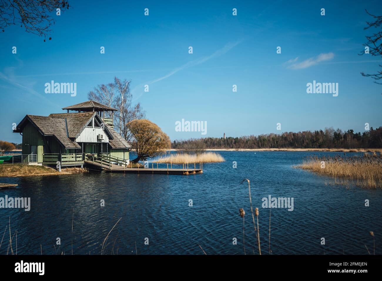 Fisherman house by the lake with boat platform Stock Photo - Alamy