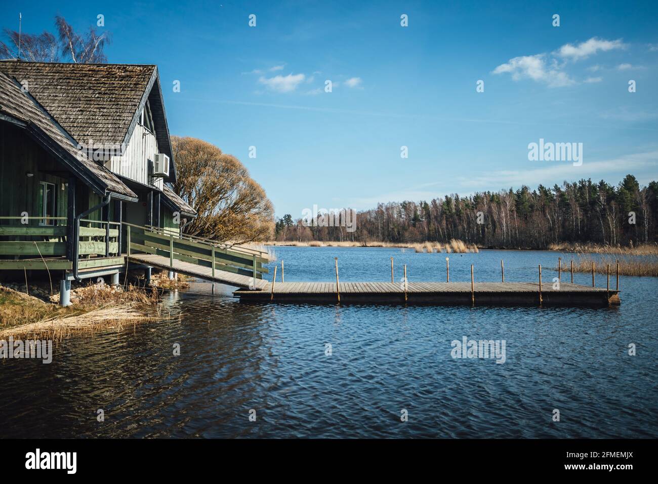 The fisherman house by the lake with boat platform Stock Photo - Alamy