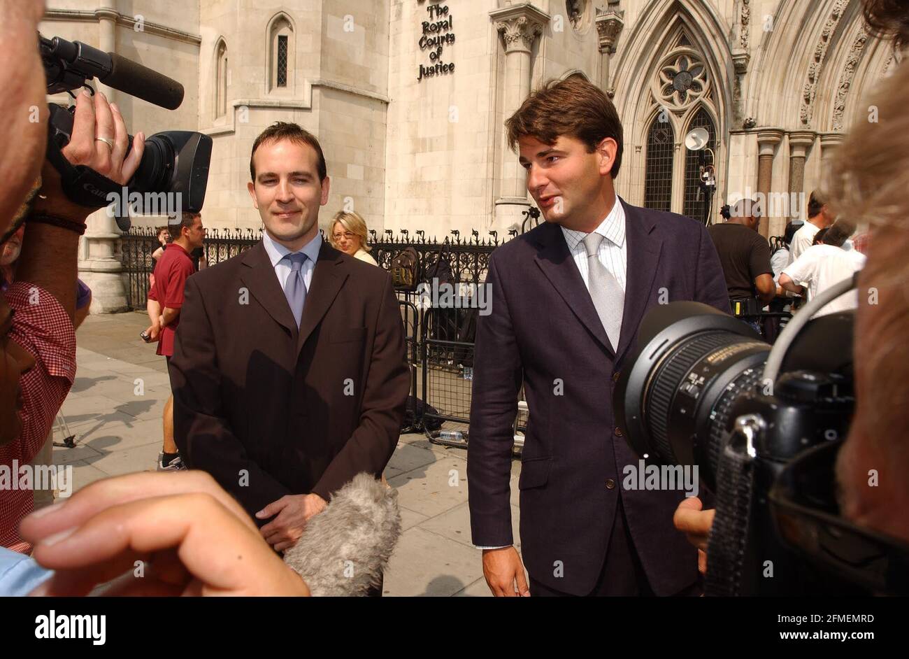 Spencer Gill (left) and Ed Bird leaving the High Court today been successfully sued for beach of contract by their old firm Counter-Fitzgerald after working for Icap.29 July 2002 photo Andy Paradise Stock Photo