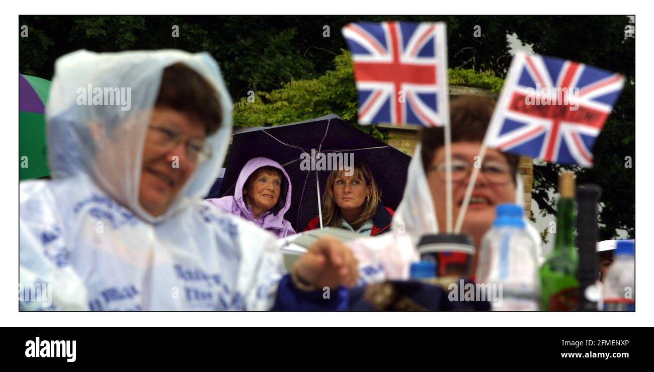 The rain in Wimbledon continues to fall.......and the fans sit and wait.pic David Sandison 3/7/2002 Stock Photo