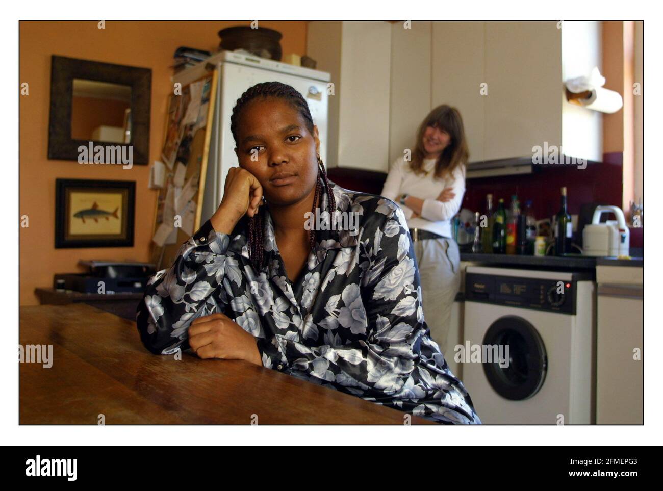 Lyndiwe Gumede (housemaid) stranded in London after her South African employer, with whom she traveled to the UK, refused to pay her and has kept her passport. She has been given assistance and somewhere to live by fellow South African Jenny Scott.pic David Sandison 26/6/2002 Stock Photo