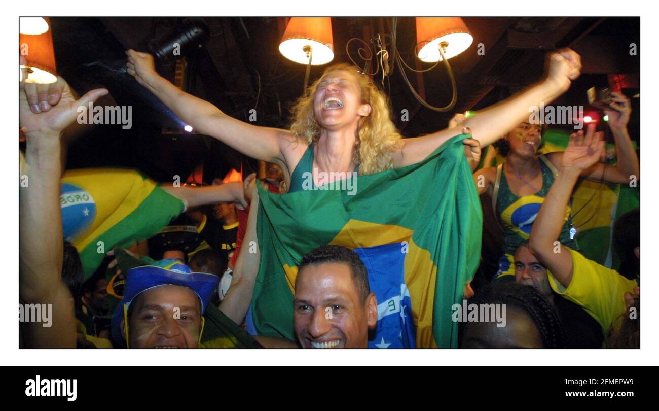 Brazil fans in Salsa Bar in London celebrate their win over England in the World Cup.pic David Sandison 21/6/2002 Stock Photo