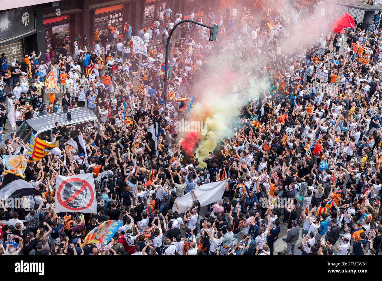 Valencia CF fans hold burning flares in front of the Mestalla stadium  during the demonstration.Valencia CF fans protest against the management of  president Peter Lim who owns the club and the company