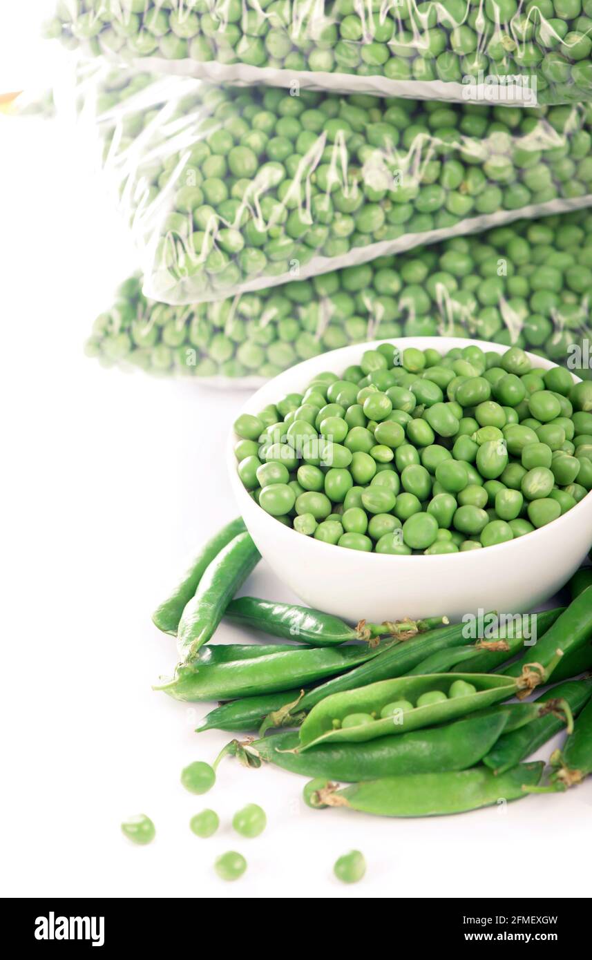 Healthy food. Fresh green peas, sweet pea isolated on white background. Stock Photo
