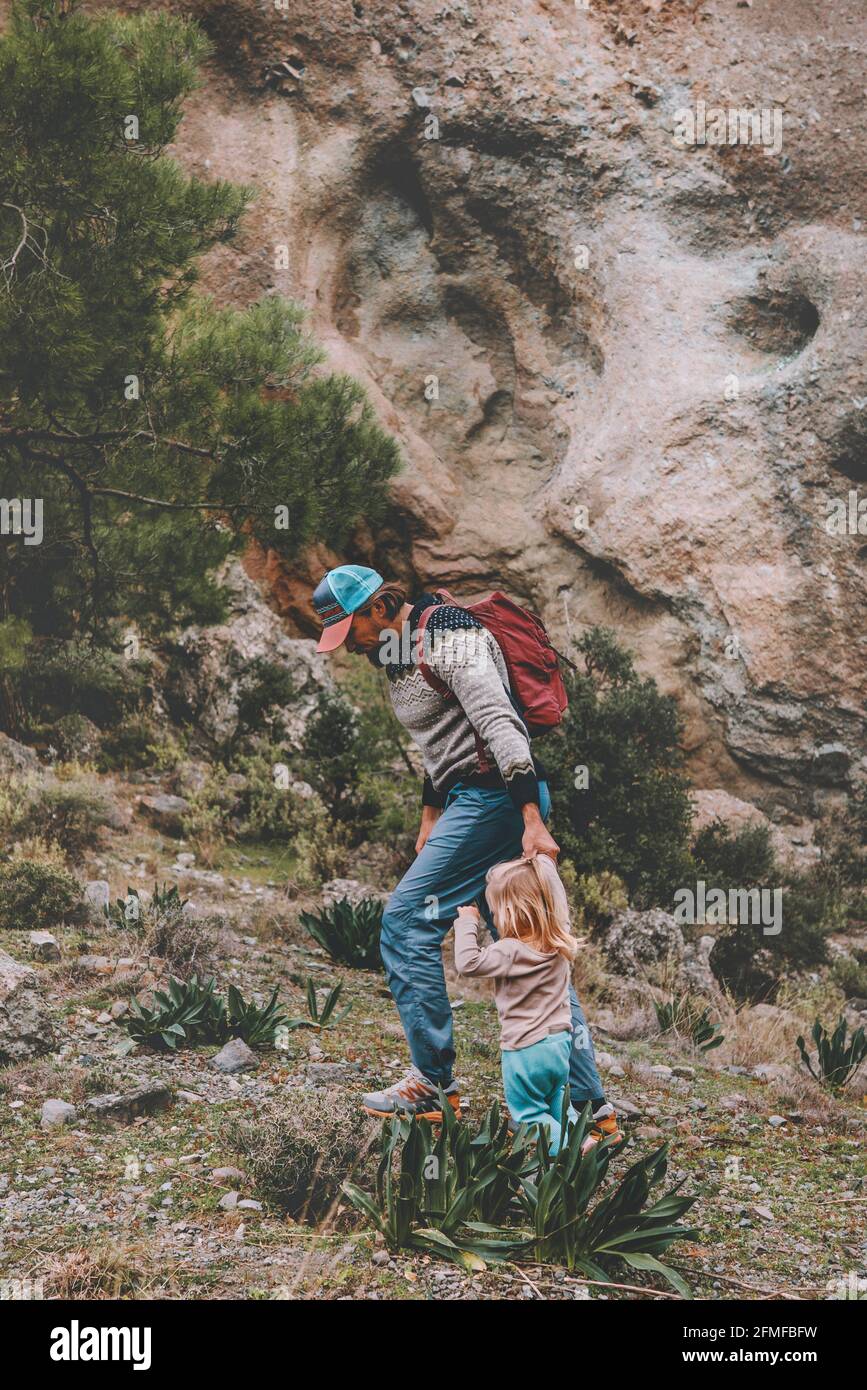 Father and child daughter hiking together family travel vacation adventure healthy lifestyle outdoor sustainable tourism Stock Photo