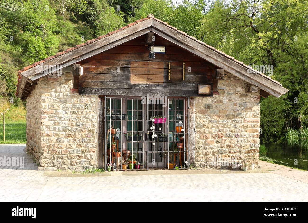 Closed shop in a traditional small stone building in Ruente Cantabria Spain Stock Photo