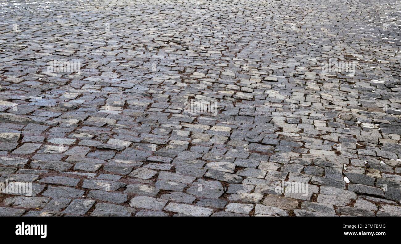 Paving stone coating in perspective. Old Stone Road Stock Photo
