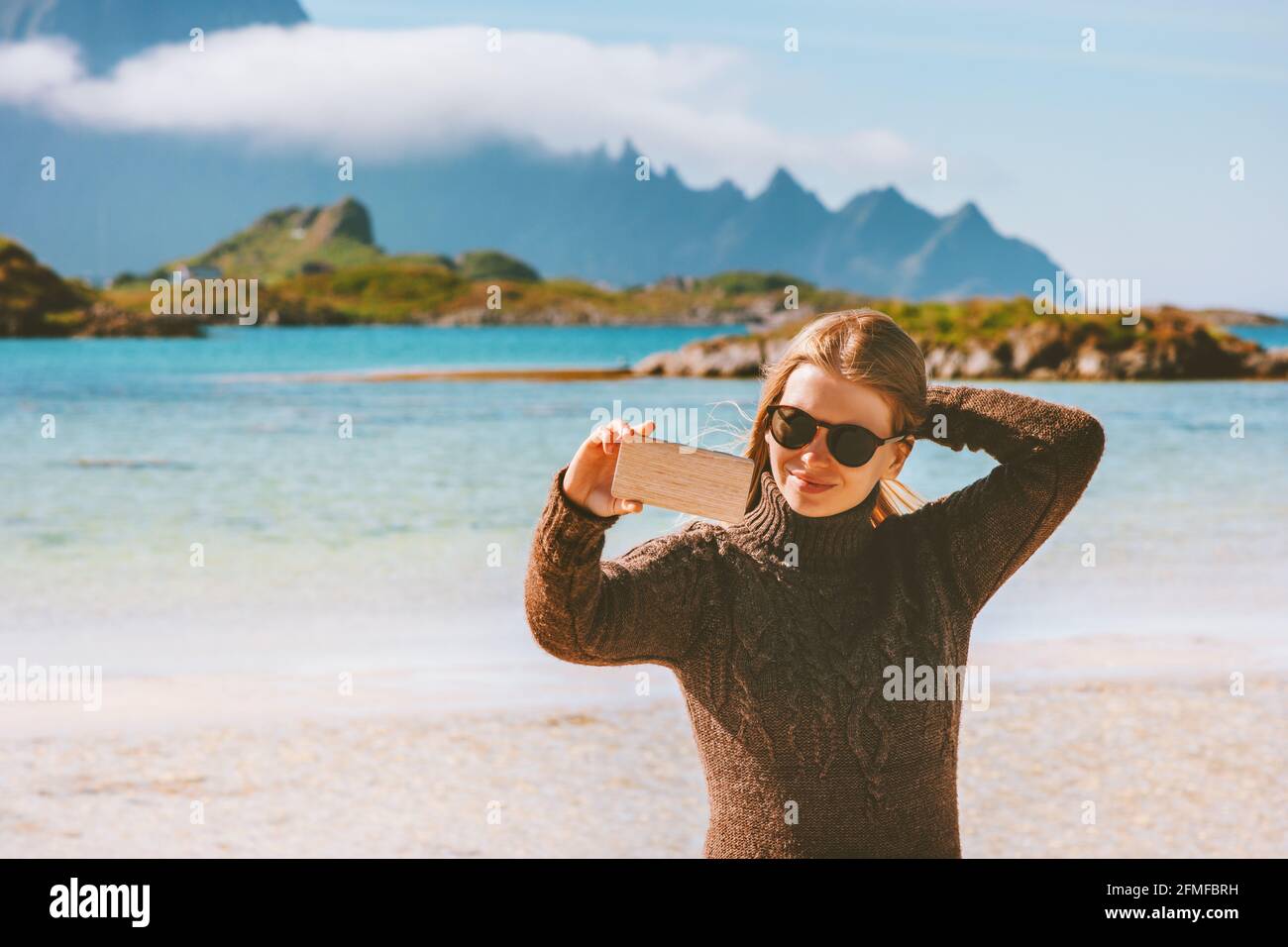 Woman blogging taking photo by smartphone camera capturing moments girl traveling alone influencer outdoor summer vacations trip Stock Photo