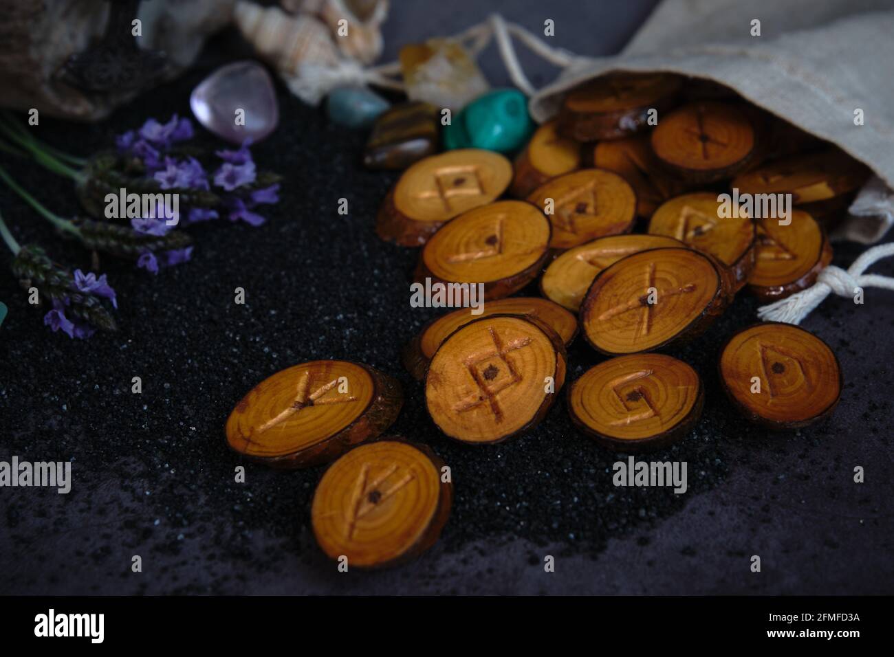 homemade wooden runes on a dark background Stock Photo - Alamy