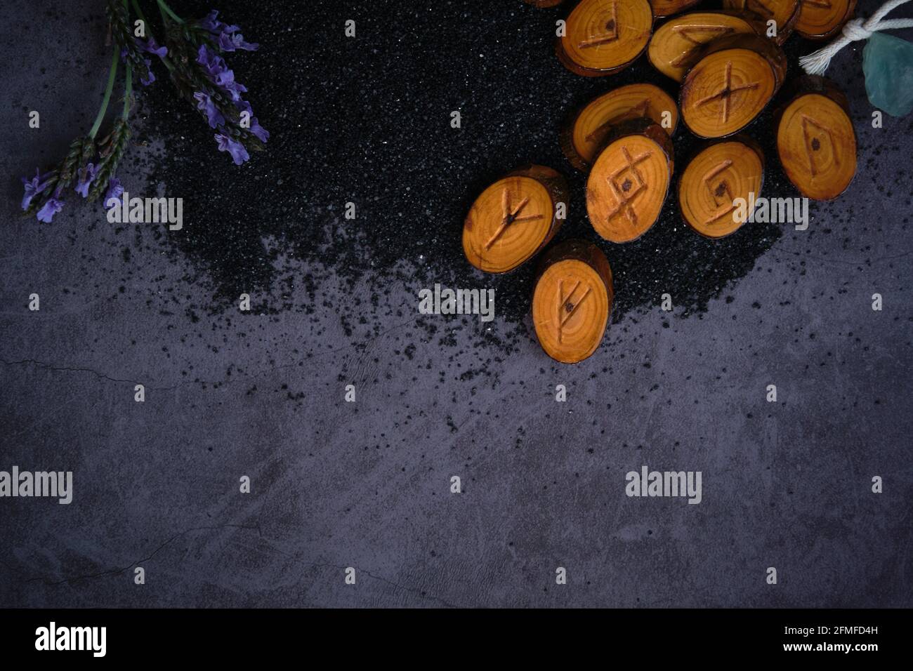 homemade wooden runes on a dark background Stock Photo - Alamy