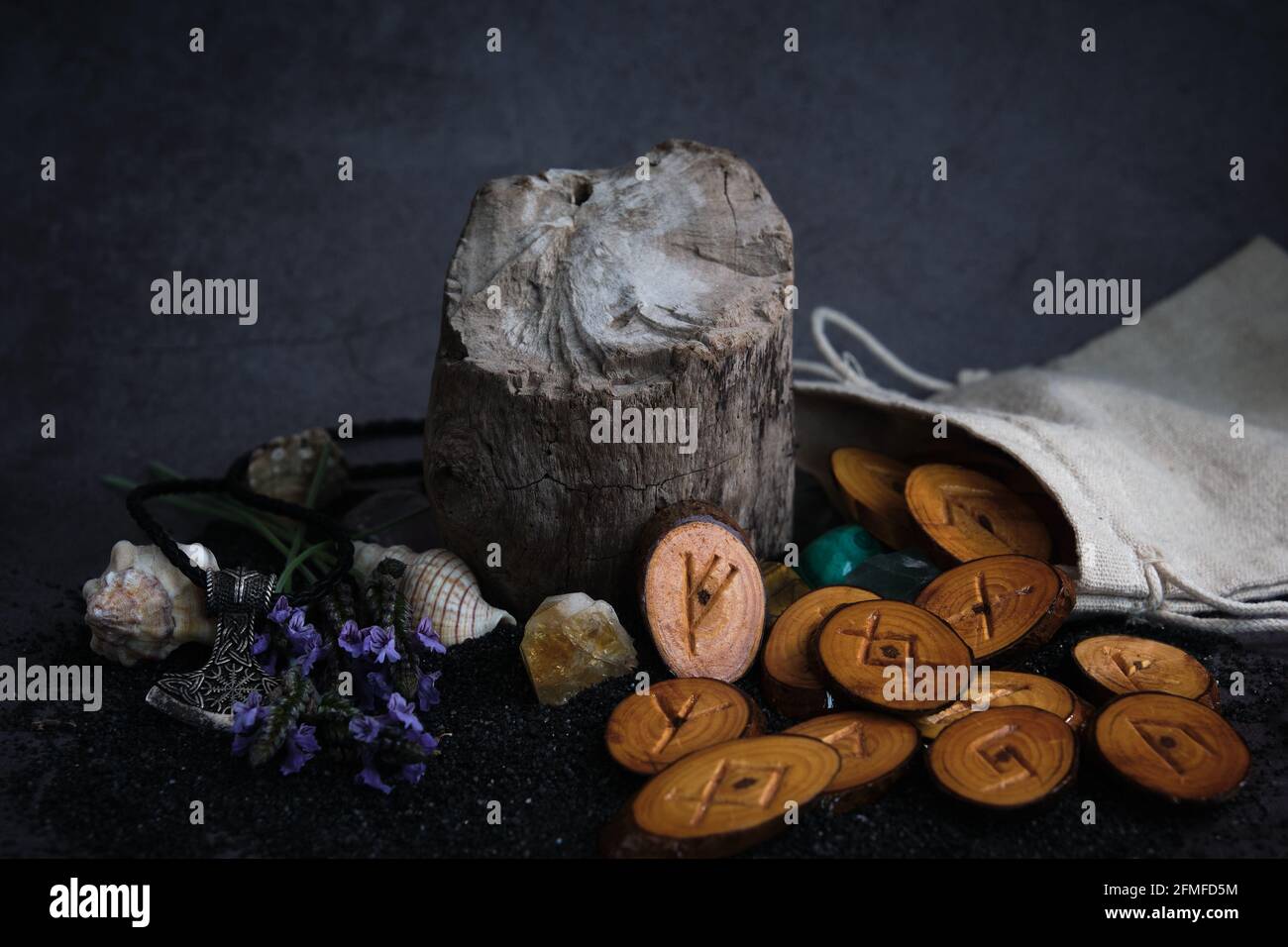 homemade wooden runes on a dark background Stock Photo - Alamy