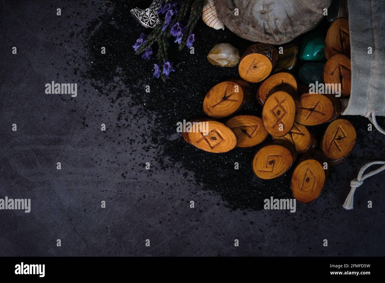 homemade wooden runes on a dark background Stock Photo - Alamy