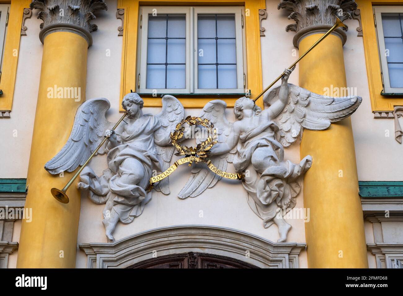 Warsaw, Poland, Wilanow Palace of King Jan III Sobieski, angels with trumpets sculptures, figures of Famae above the main entrance holding inscription Stock Photo