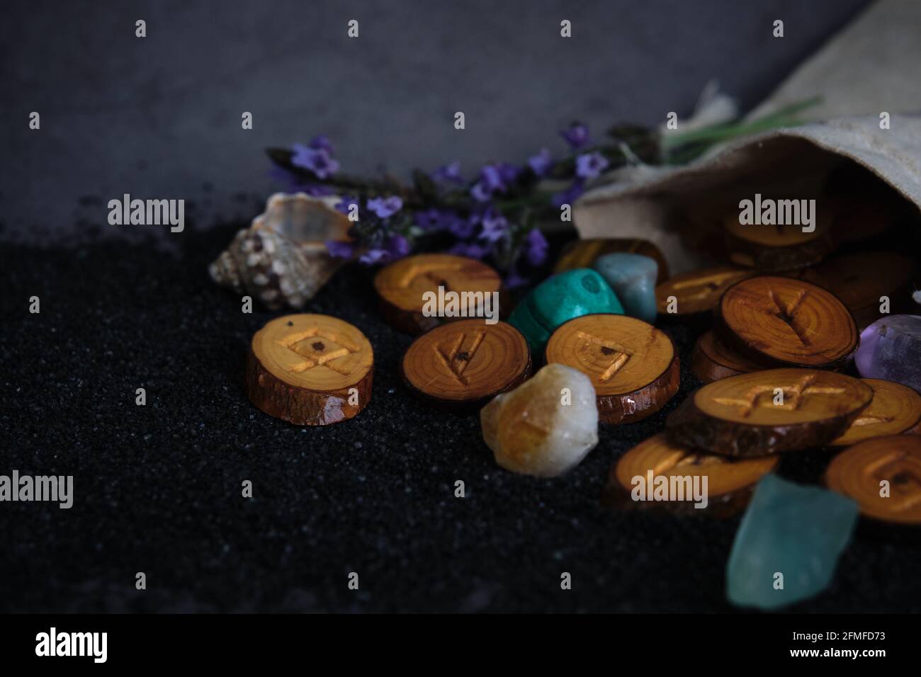 homemade wooden runes on a dark background Stock Photo - Alamy