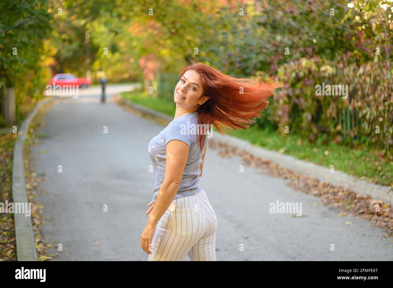 Girl in red outfit walks hi-res stock photography and images - Alamy