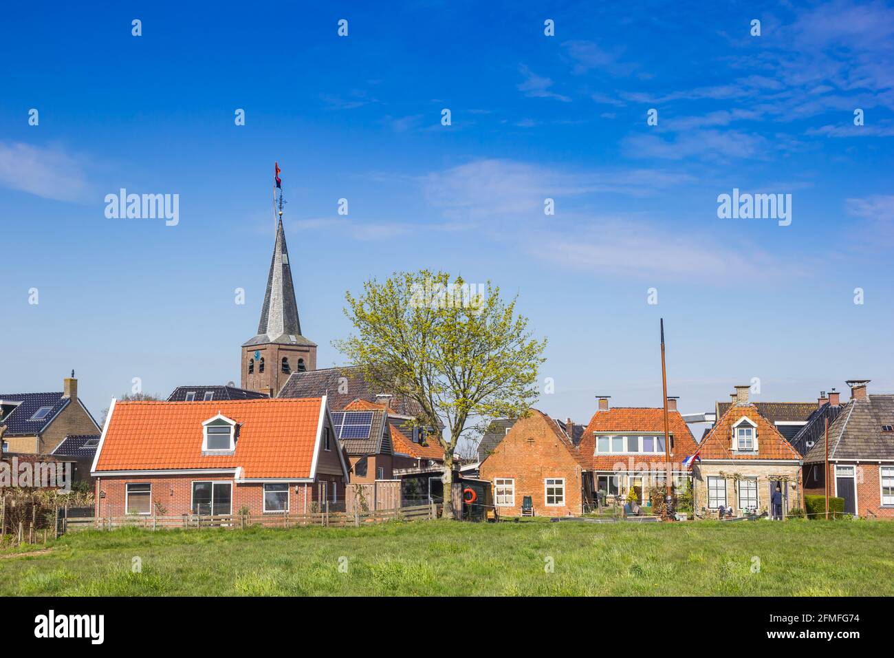 Old houses and church tower in Warten, Netherlands Stock Photo