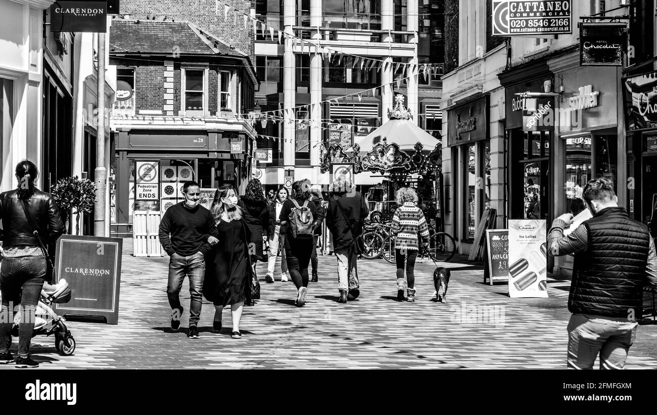 Kingston Upon Thames London, May 07 2021, Groups Of People Walking Along A Pedestrian High Street With Old and New Architecture Stock Photo