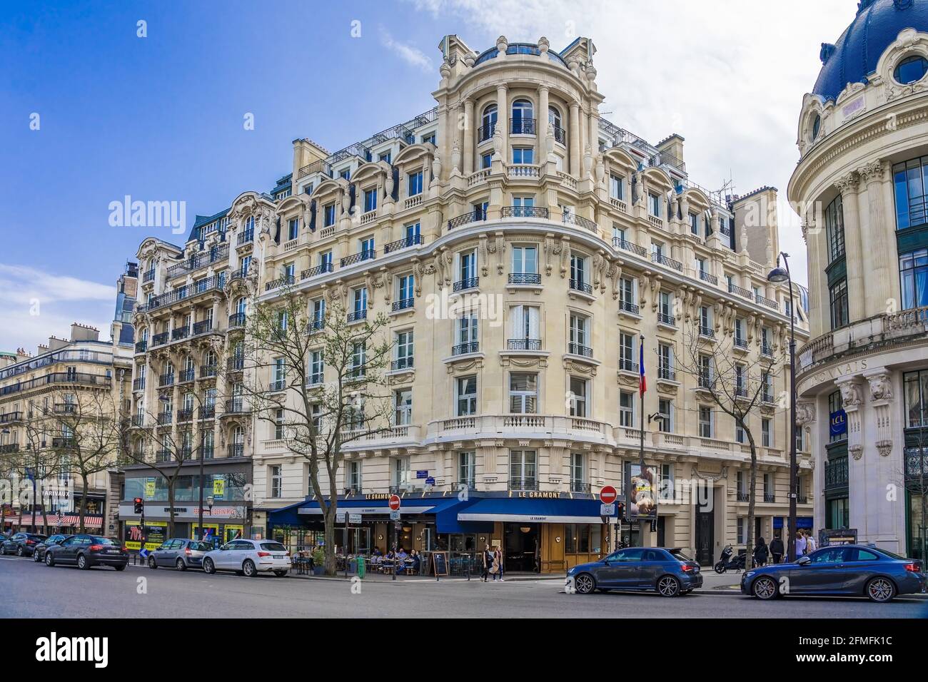 Paris residential buildings. Old Paris architecture, beautiful facade, typical french houses on sunny day. Famous travel destinations in Europe. City Stock Photo