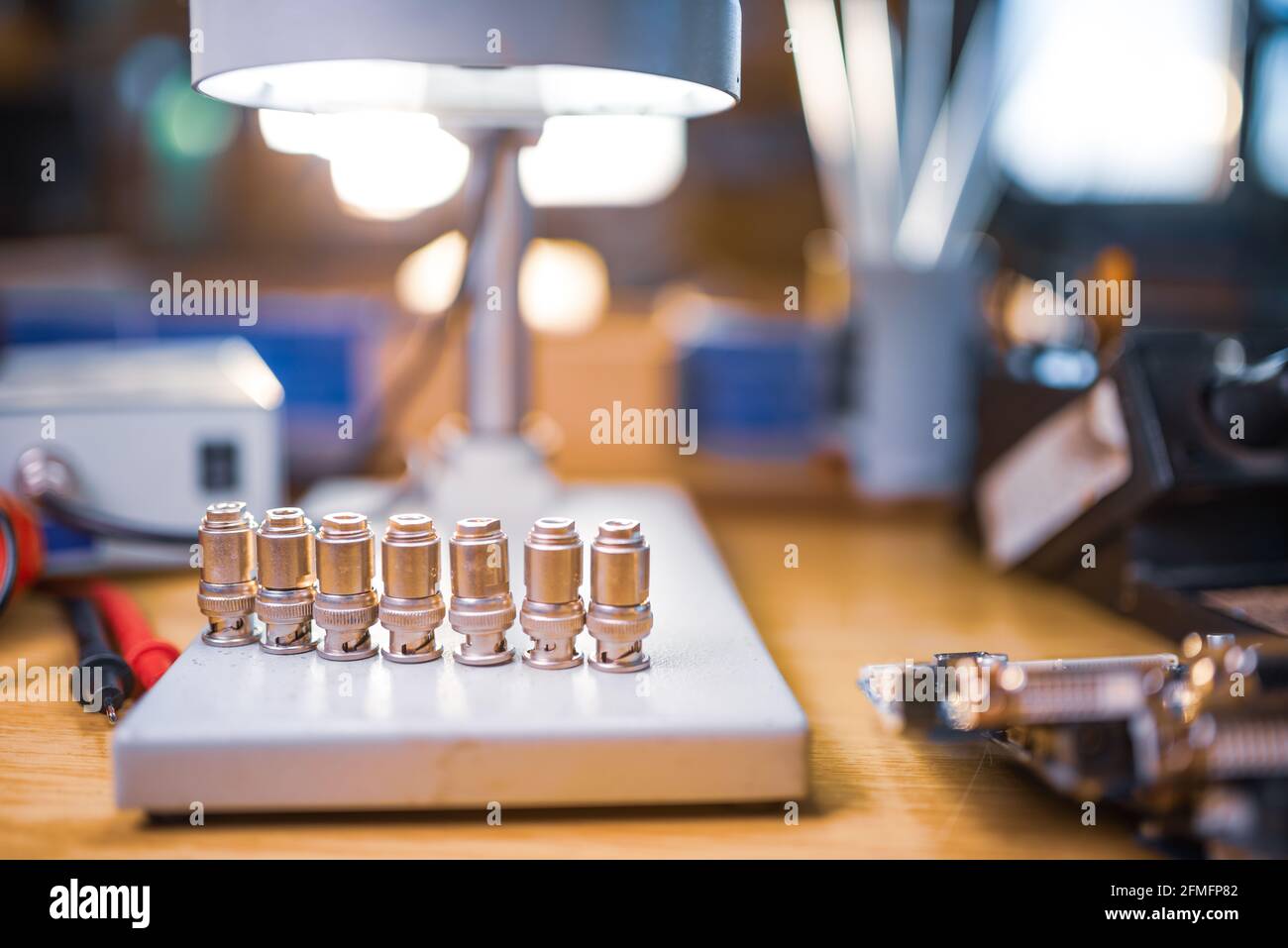 Modern microscope, connectors component and large green microcircuit in ...
