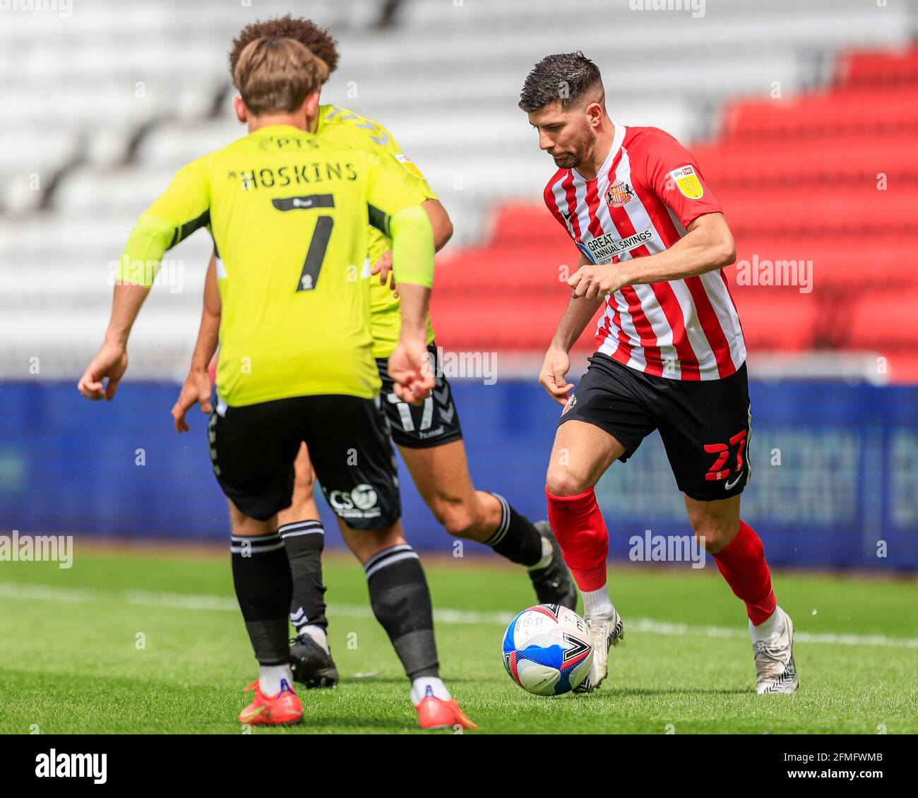 Sunderland, UK. 09th May, 2021. Jordan Jones #27 of Sunderland looks to dribble past Sam Hoskins #7 of Northampton Town and Shaun McWilliams #17 of Northampton Town in Sunderland, United Kingdom on 5/9/2021. (Photo by Iam Burn/News Images/Sipa USA) Credit: Sipa USA/Alamy Live News Stock Photo