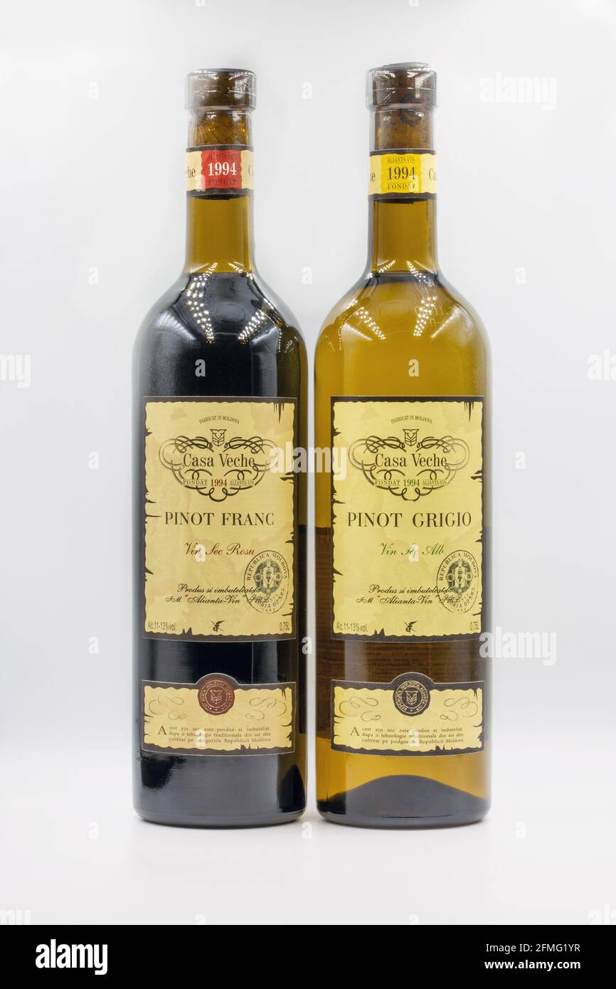 KYIV, UKRAINE - FEBRUARY 27, 2021: Pinot Grigio and Pinot Franc white and red dry wine bottles from Casa Veche Moldavian winery closeup against white Stock Photo
