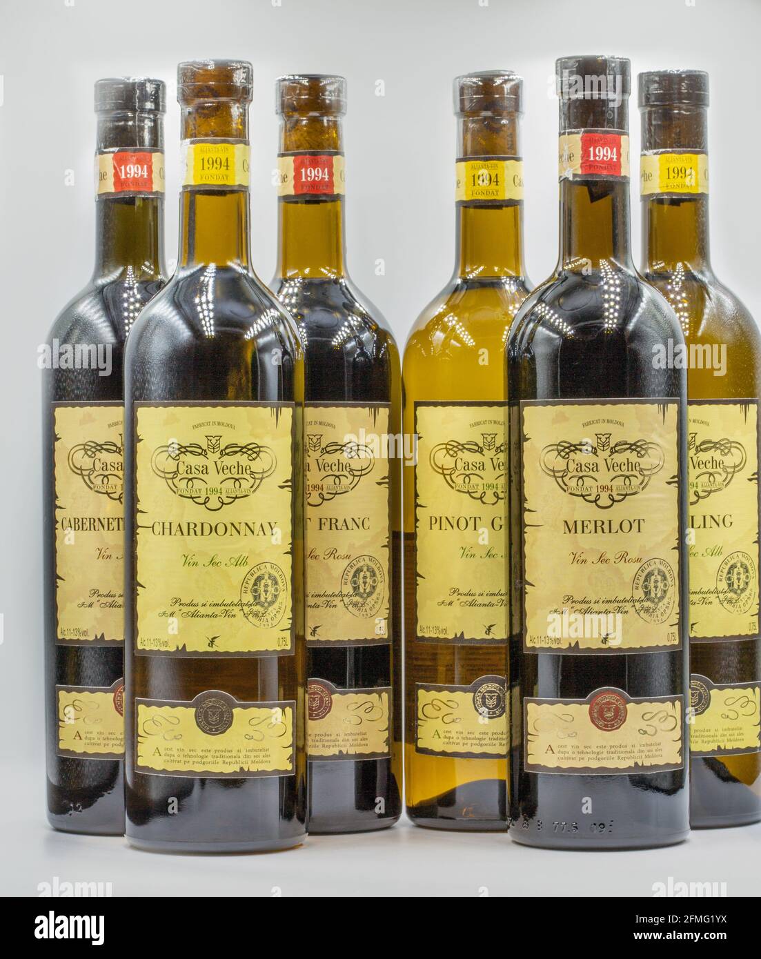 KYIV, UKRAINE - FEBRUARY 27, 2021: Riesling, Chardonnay, Pinot Grigio, Pinot Franc, Merlot and Cabernet Sauvignon white and red dry wine bottles from Stock Photo