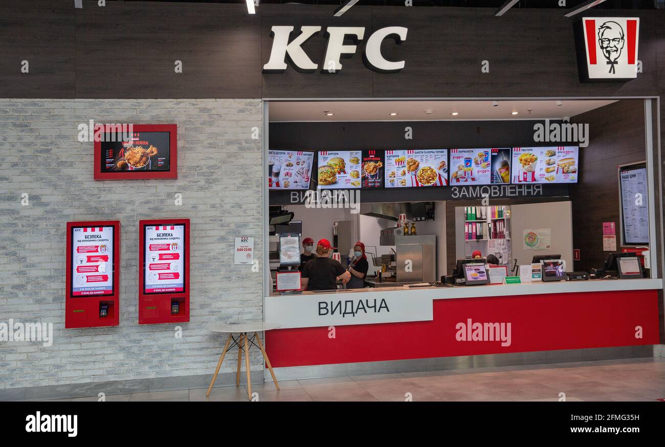 KYIV, UKRAINE - APRIL 22, 2021: KFC or Kentucky Fried Chicken fast food restaurant facade. KFC is a fast food restaurant chain that specializes in fri Stock Photo