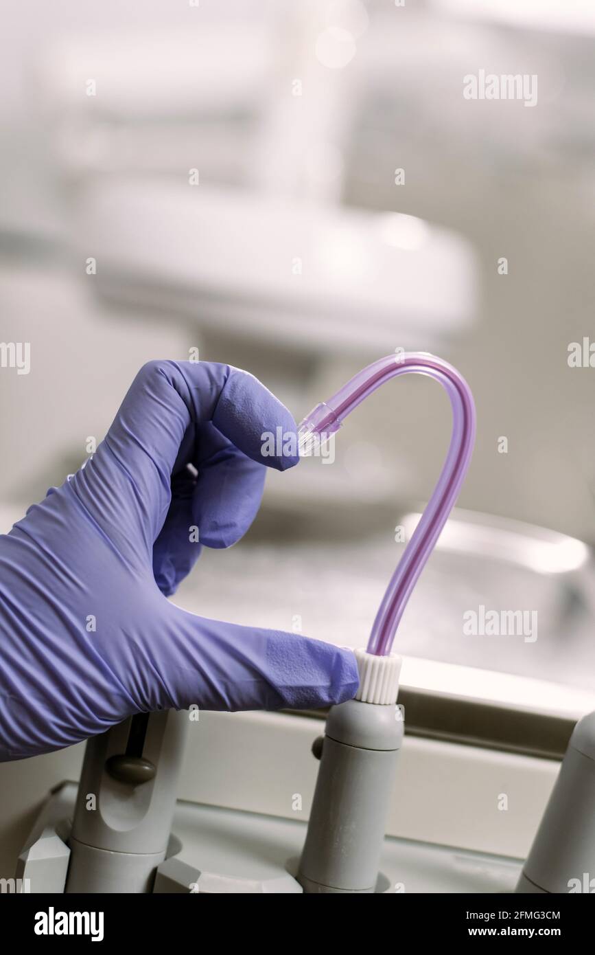 Dental treatment, healthcare and dentistry concept. The woman's hand