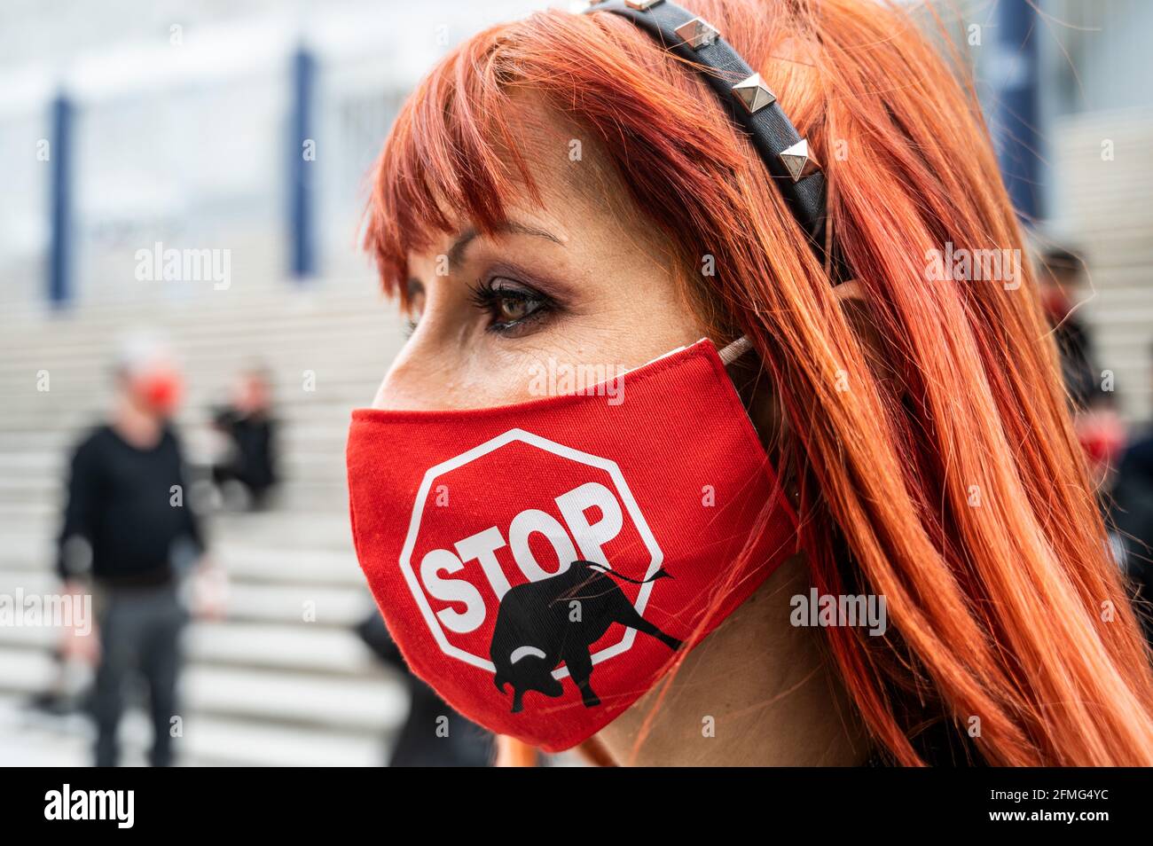 Madrid, Spain. 09th May, 2021. An animal rights activist wearing a face mask during a protest against bullfighting as the bullfighting season starts in Madrid next week for San Isidro festivity. Animal rights group Anima Naturalis gathered to protest in Vista Alegre bullring of Madrid demanding the abolition of bullfighting, shouting slogans against animal cruelty and animal torture. The Bullfighting season will start next week with a maximum capacity of 40% and a maximum of 6,000 spectators due to healthcare measures to stop the spread of coronavirus. Credit: Marcos del Mazo/Alamy Live News Stock Photo