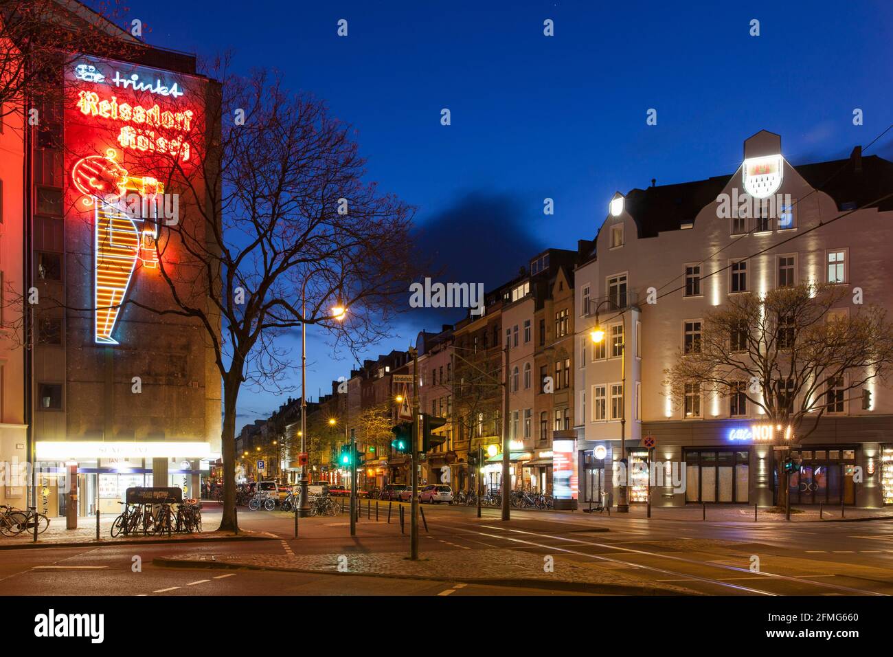 curfew from 9 pm during corona pandemic lockdown on May 5th. 2021. The deserted Aachener street at Rudolfplatz square, neon sign of the Reissdorf brew Stock Photo