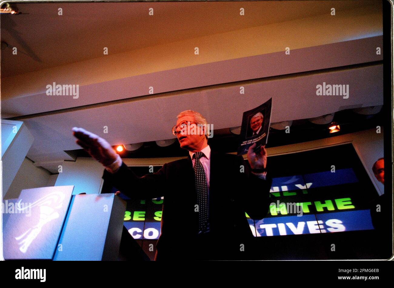 John Major holds the Conservative manifesto up during a press ...