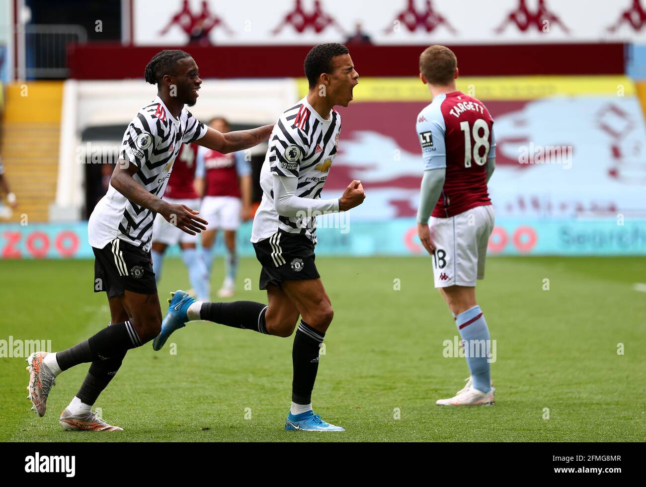 Manchester United's Mason Greenwood (right) celebrates scoring their side's second goal of the game during the Premier League match at Villa Park, Birmingham. Picture date: Sunday May 9, 2021. Stock Photo