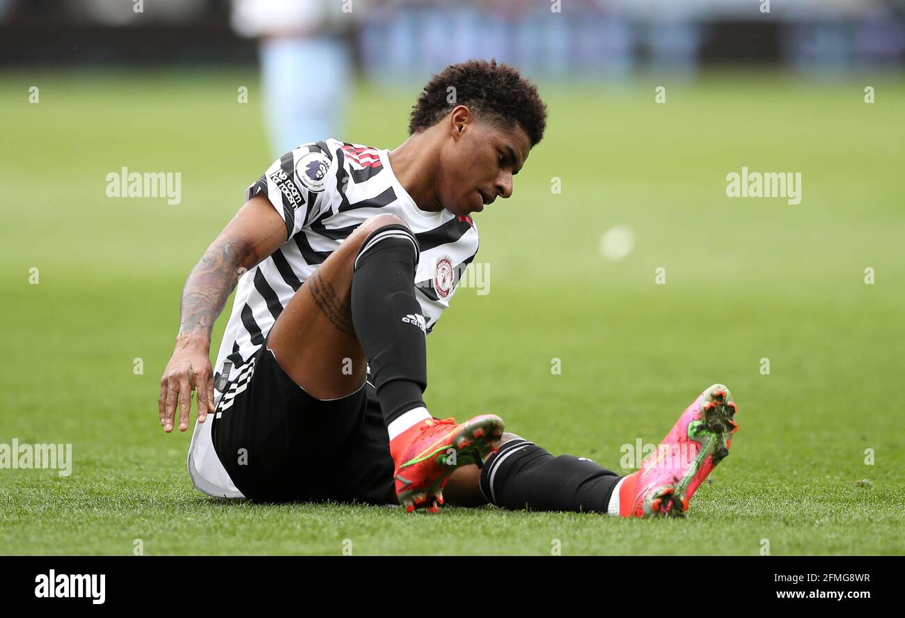 Manchester United's Marcus Rashford reacts on the floor during the ...