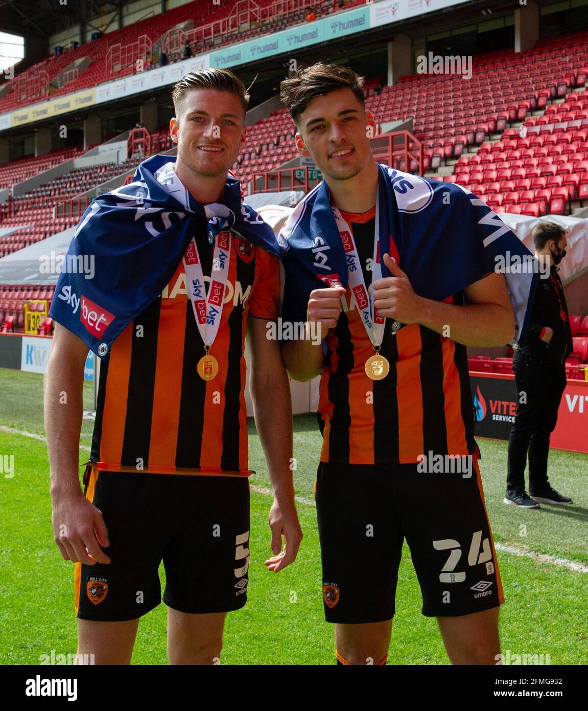 London, UK. 09th May, 2021. Reece Burke of Hull City and Jacob Greaves of Hull City (right) celebrate after wining the Sky Bet League One Trophy 2020/2021 during the Sky Bet League 1 behind closed doors match between Charlton Athletic and Hull City at The Valley, London, England on 9 May 2021. Photo by Alan Stanford/PRiME Media Images. Credit: PRiME Media Images/Alamy Live News Stock Photo