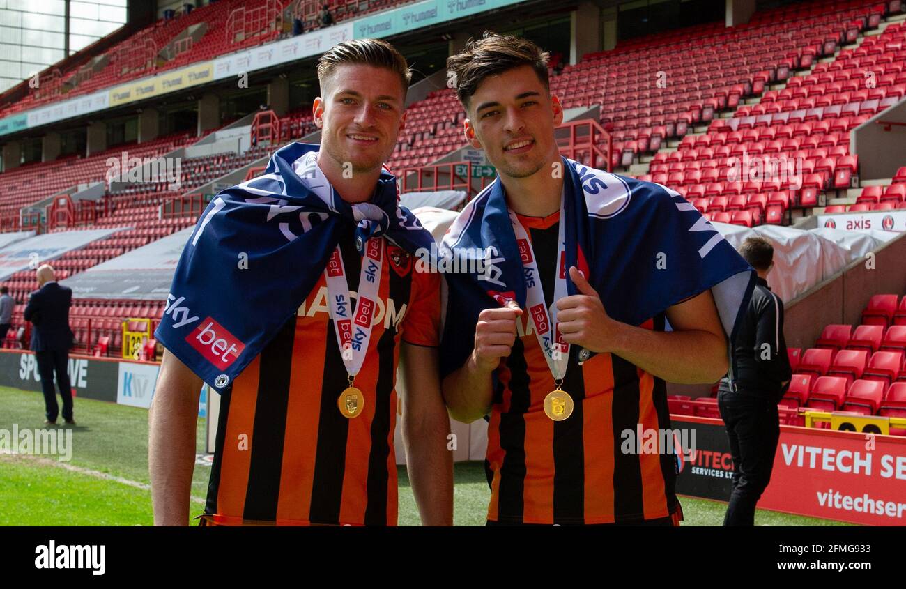 London, UK. 09th May, 2021. Reece Burke of Hull City and Jacob Greaves of Hull City (right) celebrate after wining the Sky Bet League One Trophy 2020/2021 during the Sky Bet League 1 behind closed doors match between Charlton Athletic and Hull City at The Valley, London, England on 9 May 2021. Photo by Alan Stanford/PRiME Media Images. Credit: PRiME Media Images/Alamy Live News Stock Photo