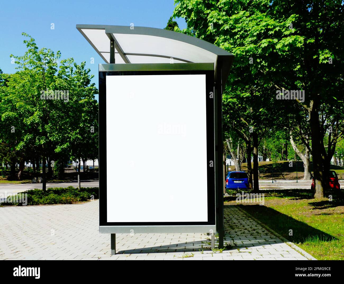 bus shelter. transit stop. blank white lightbox. glass structure. urban