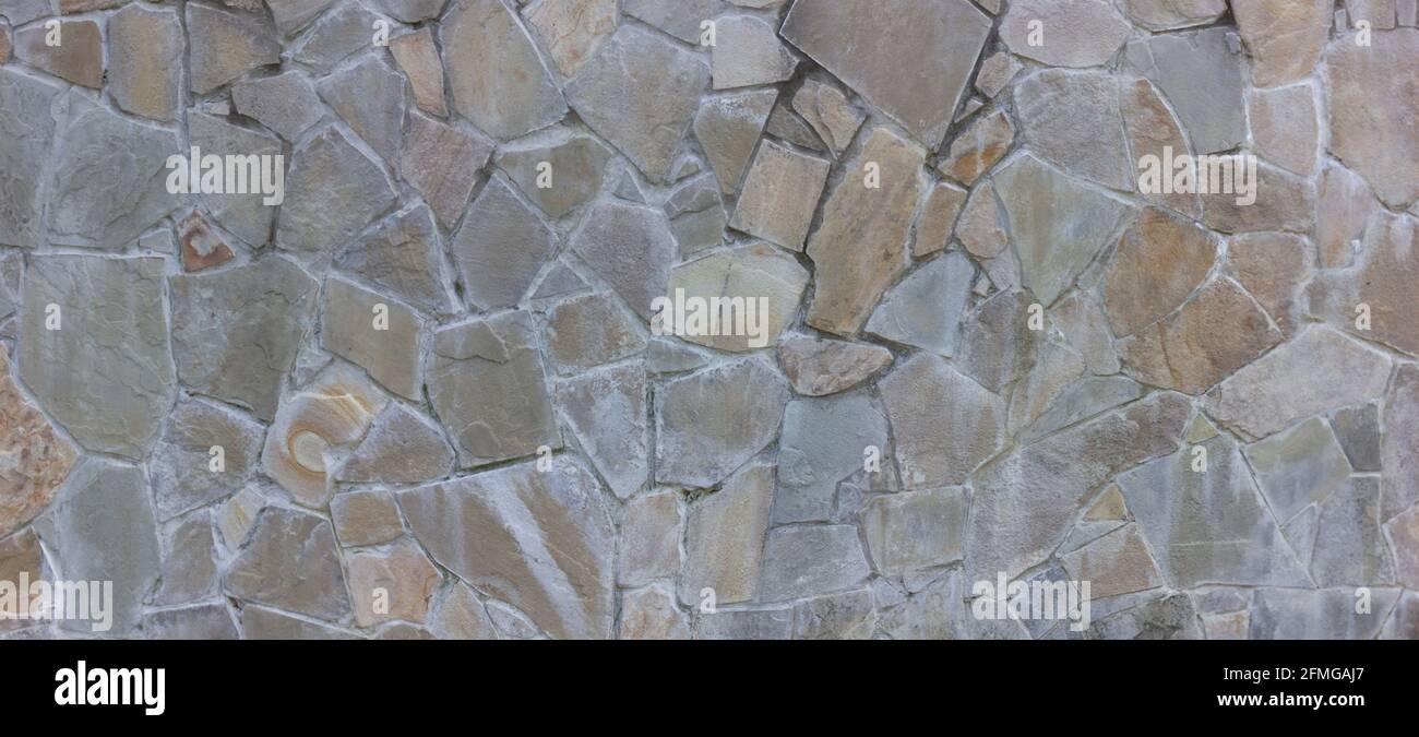 Natural stone wall textured background. Stock Photo