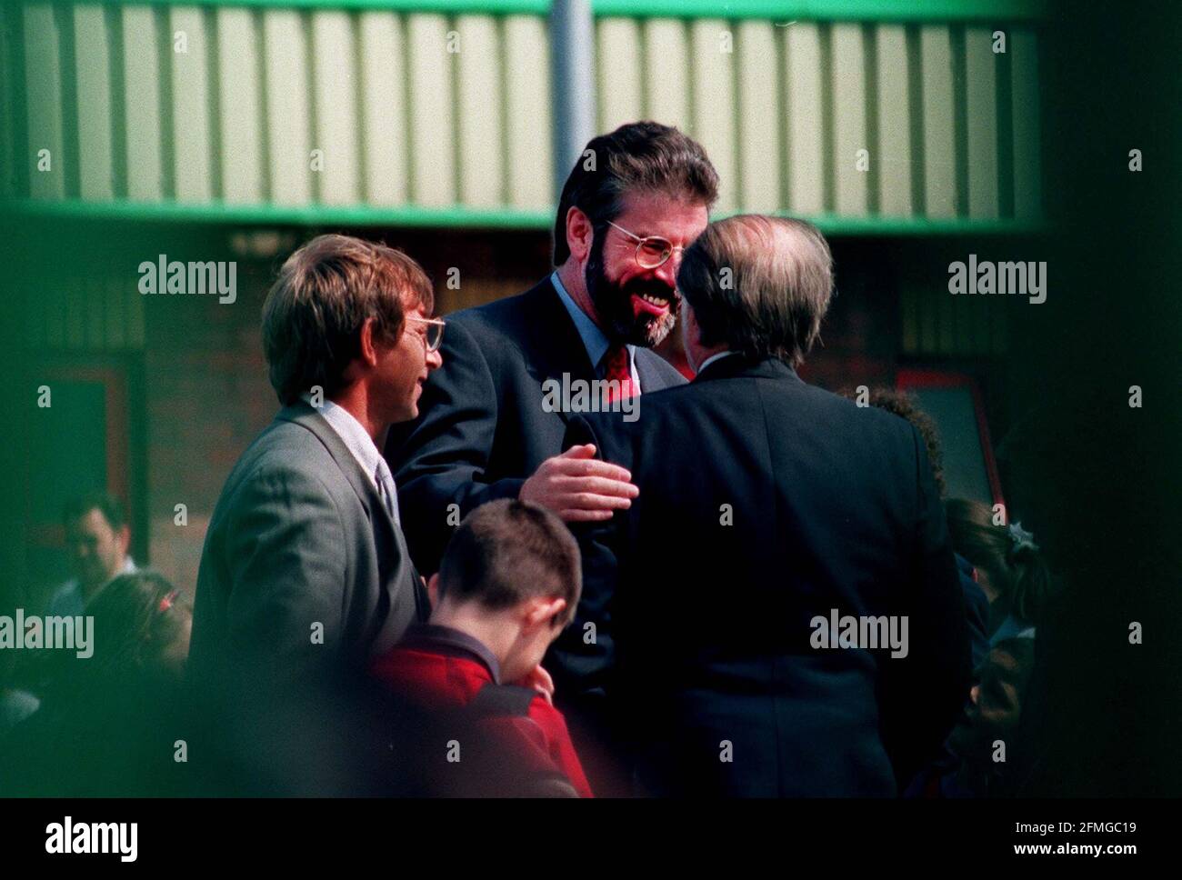 A cheerful Gerry Adams after voting in West Belfast with fellow constituents during the Ulster Peace Referendum Stock Photo