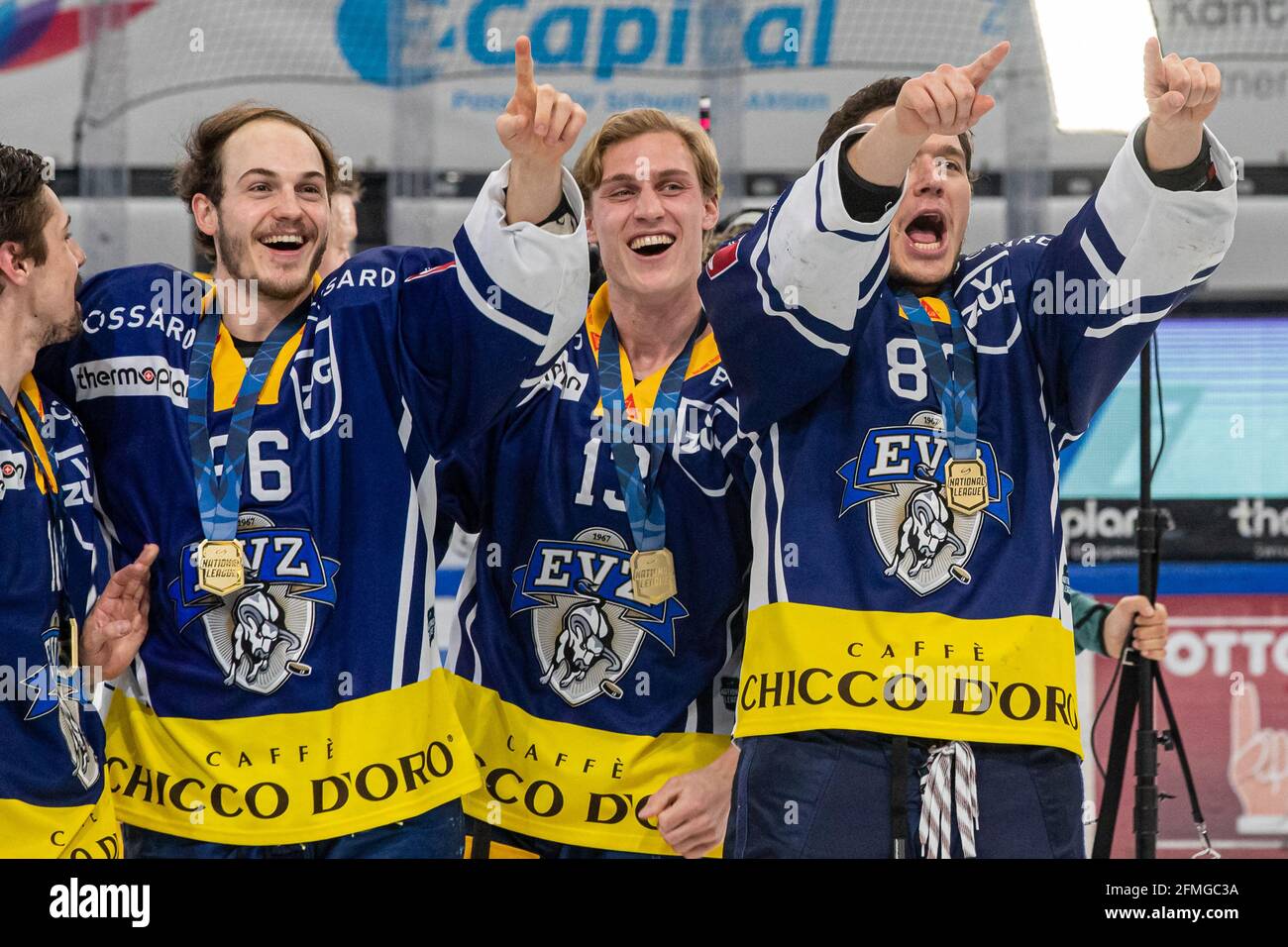 Nico Gross # 66 (EV Zug), Dario Wuethrich # 13 (EV Zug) and Calvin Thuerkauf # 83 (EV Zug) celebrate during the National League Playoff Final ice hockey game 3 between EV