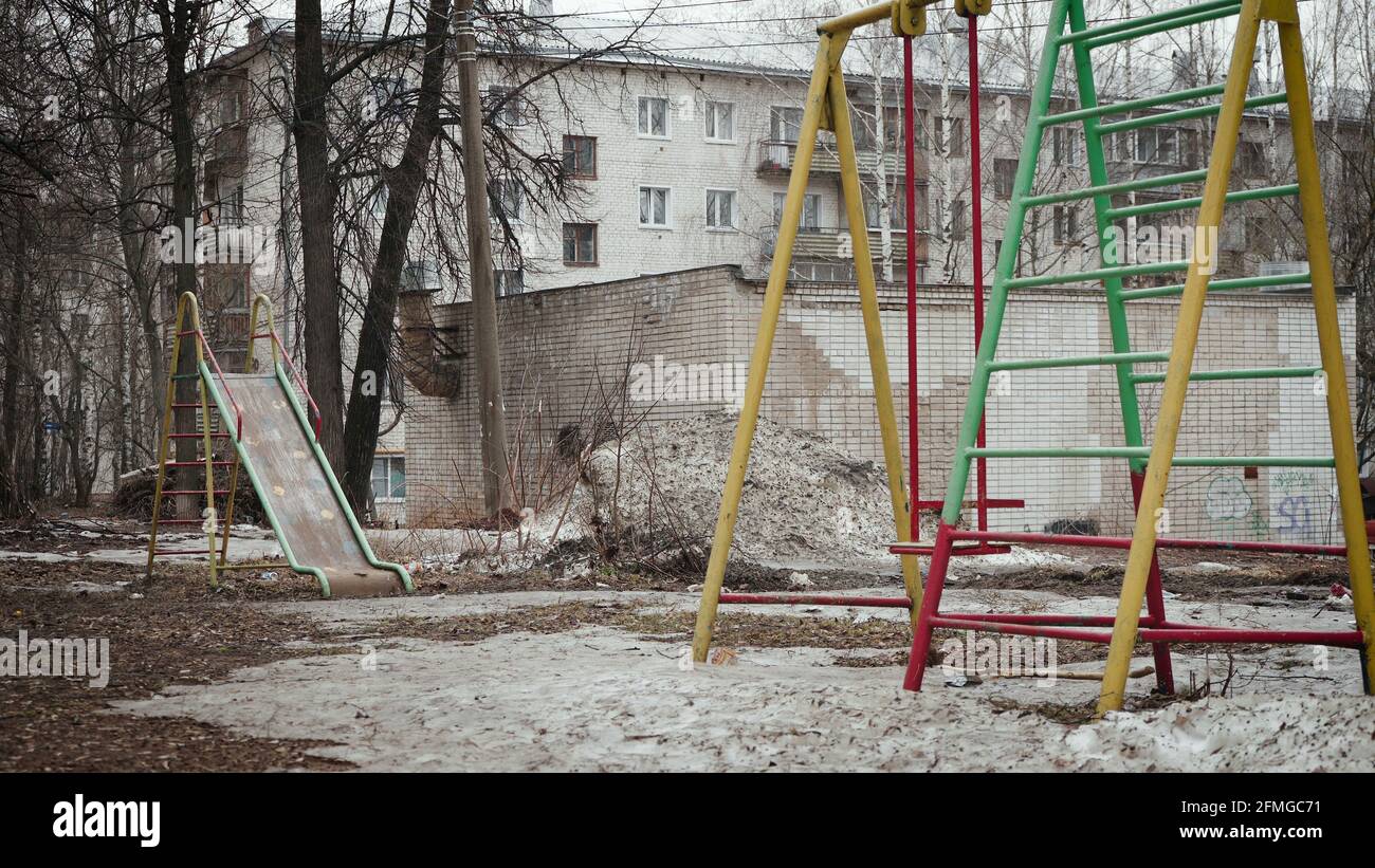 Photo of abandoned dirty street with playground Stock Photo Alamy