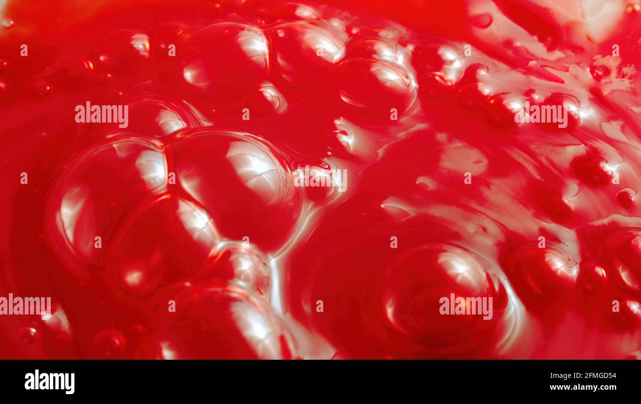 Image of the bubbled red liquid, close-up Stock Photo