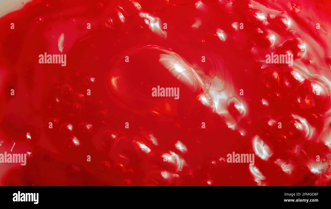 Photo of the bubbled red liquid, close-up Stock Photo