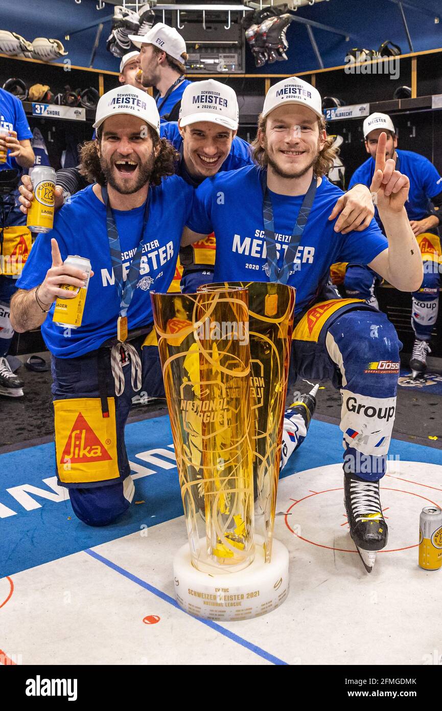 Dominik Schlumpf # 18 (EV Zug), Tobias Geisser # 42 (EV Zug) and Sven  Senteler # 88 (EV Zug) during the National League Playoff Final ice hockey  game 3 between EV Zug