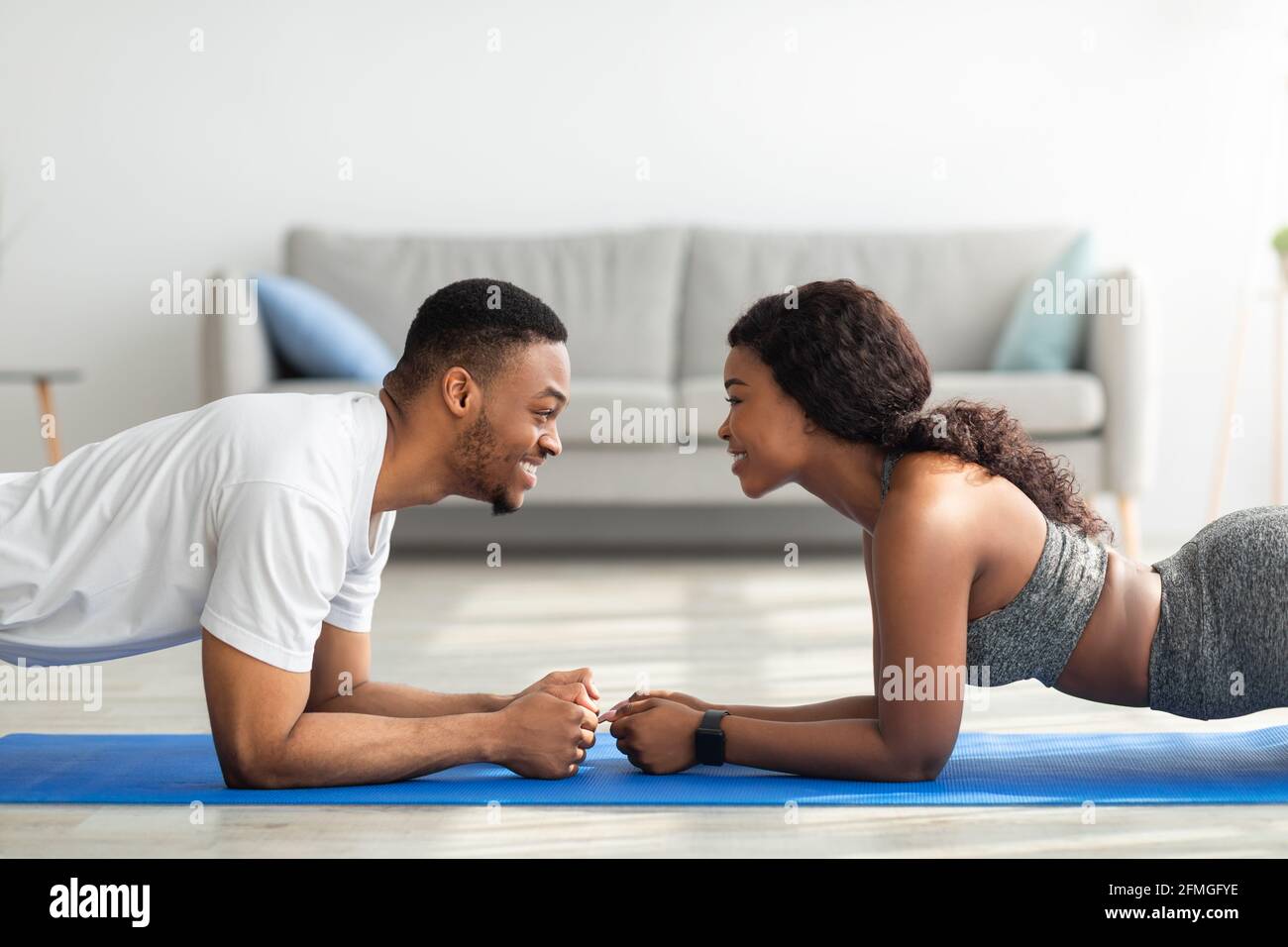 Side profile of a couple looking at each other Stock Photo - Alamy